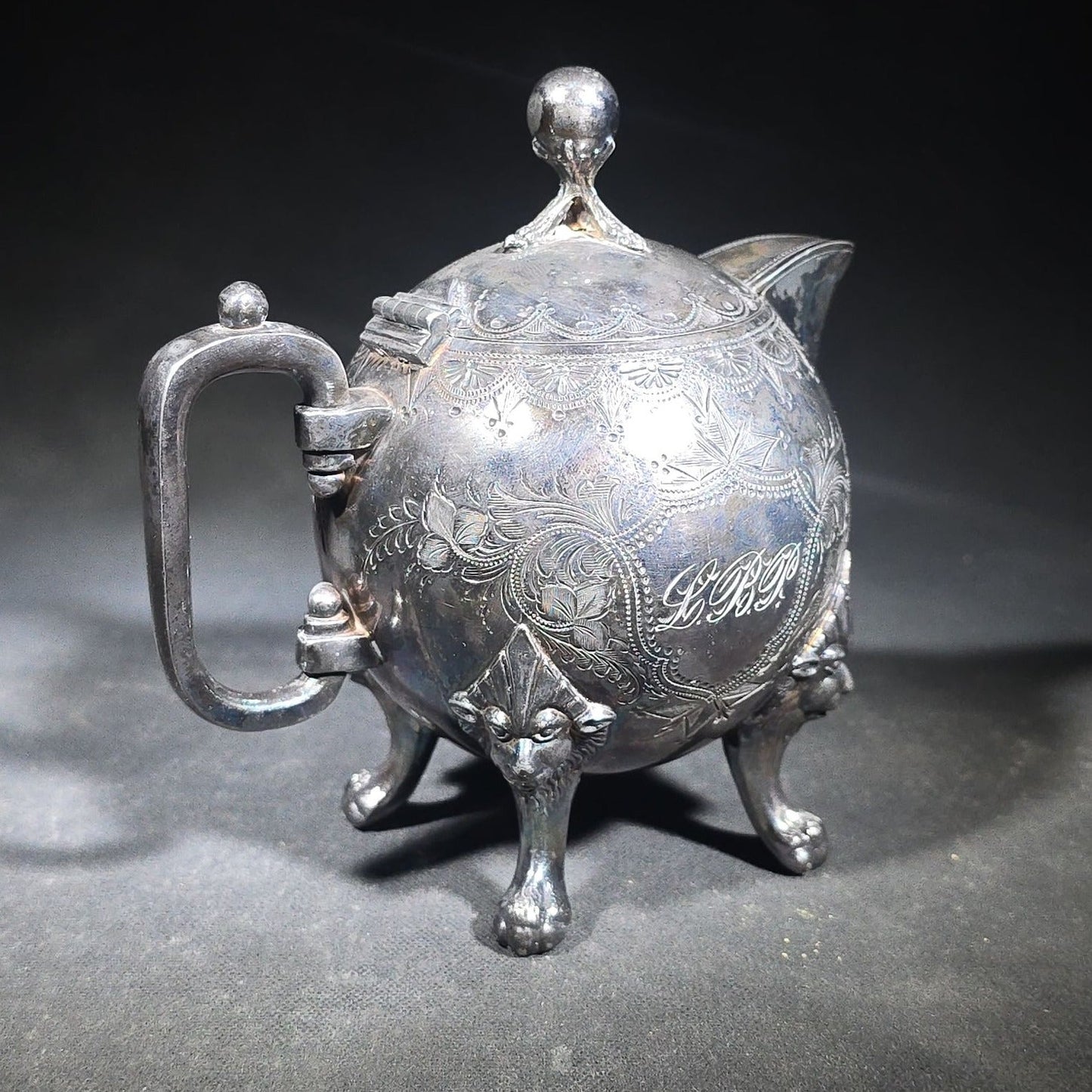 Pair of Antique Silverplate Serving Pieces including Reed & Barton Footed Coffeepot No. 2930 and Monogrammed Spherical Teapot with Lion Mask and Paw Feet