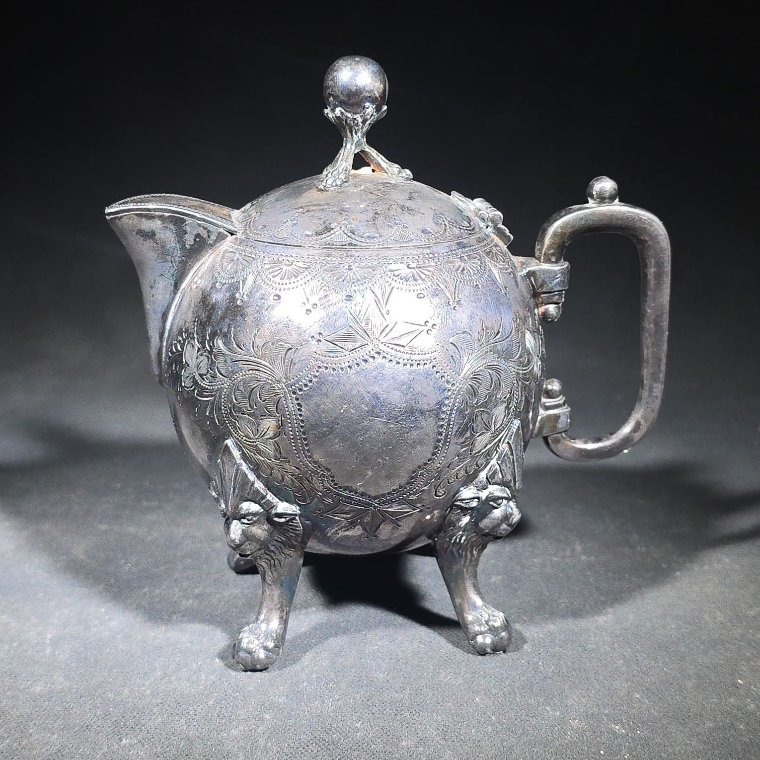 Pair of Antique Silverplate Serving Pieces including Reed & Barton Footed Coffeepot No. 2930 and Monogrammed Spherical Teapot with Lion Mask and Paw Feet