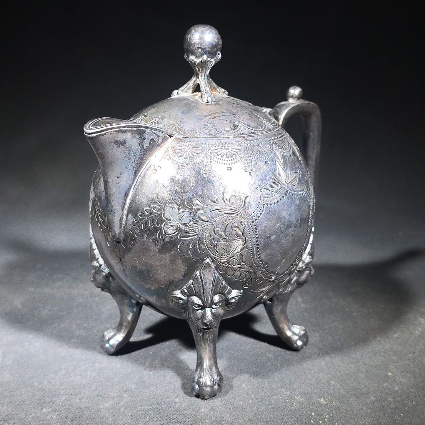 Pair of Antique Silverplate Serving Pieces including Reed & Barton Footed Coffeepot No. 2930 and Monogrammed Spherical Teapot with Lion Mask and Paw Feet