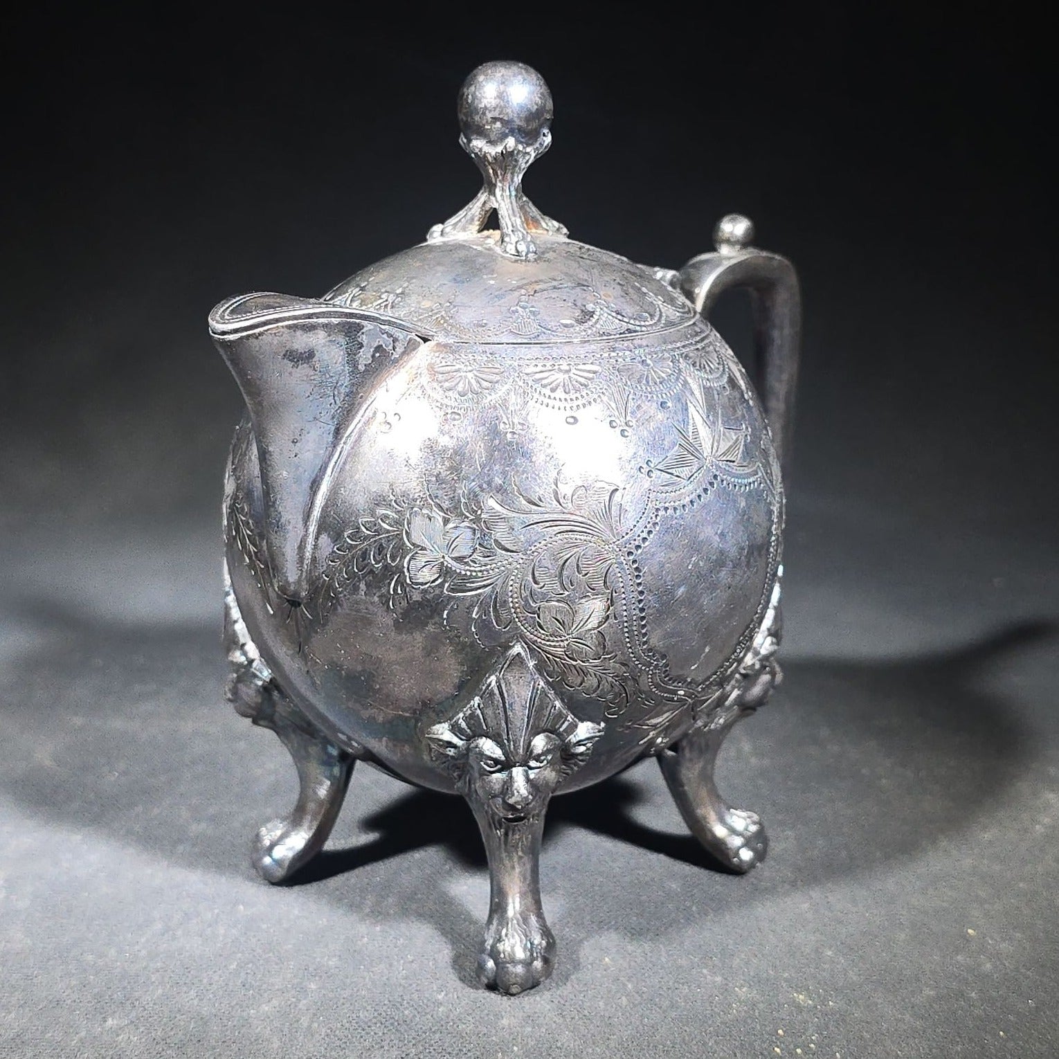 Pair of Antique Silverplate Serving Pieces including Reed & Barton Footed Coffeepot No. 2930 and Monogrammed Spherical Teapot with Lion Mask and Paw Feet