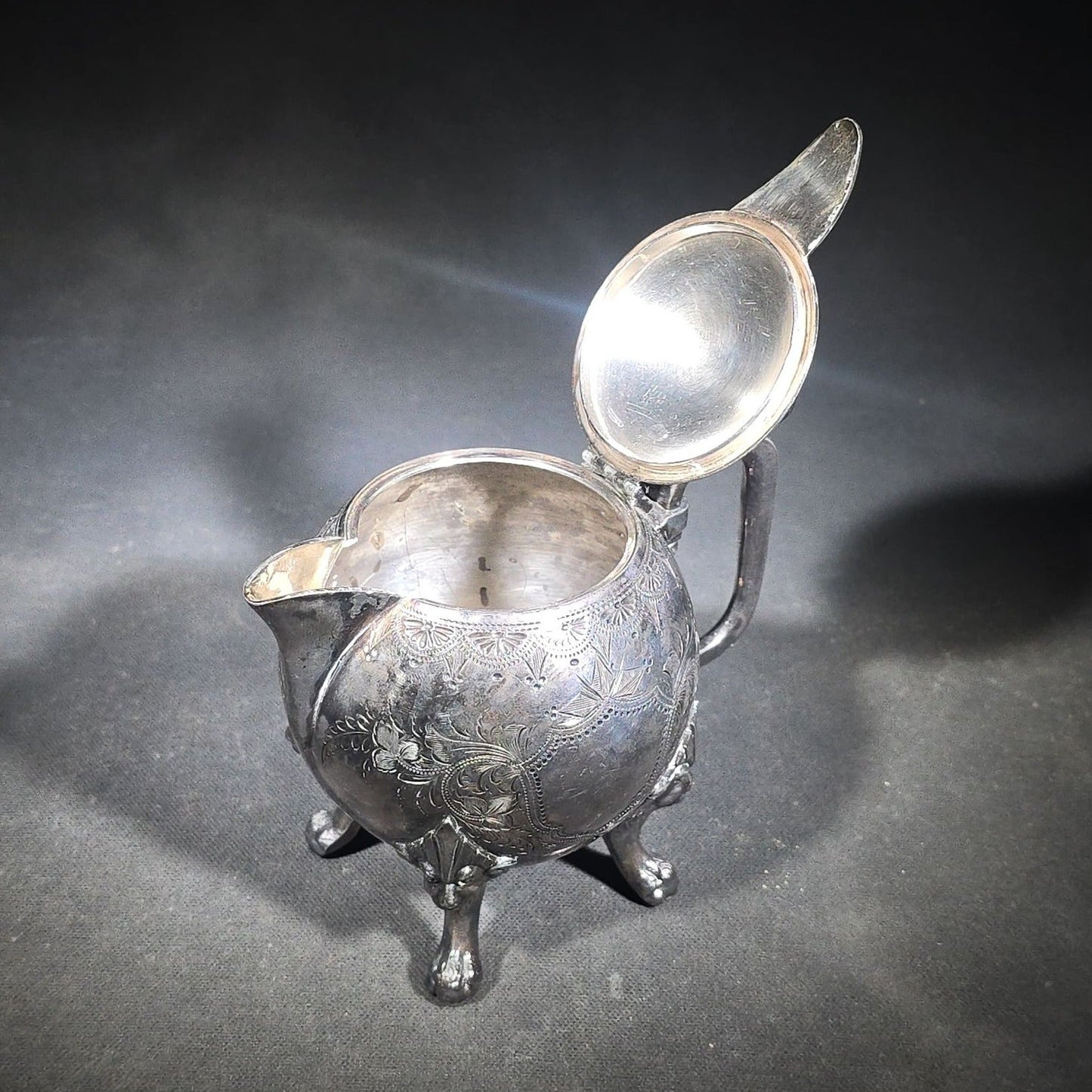 Pair of Antique Silverplate Serving Pieces including Reed & Barton Footed Coffeepot No. 2930 and Monogrammed Spherical Teapot with Lion Mask and Paw Feet