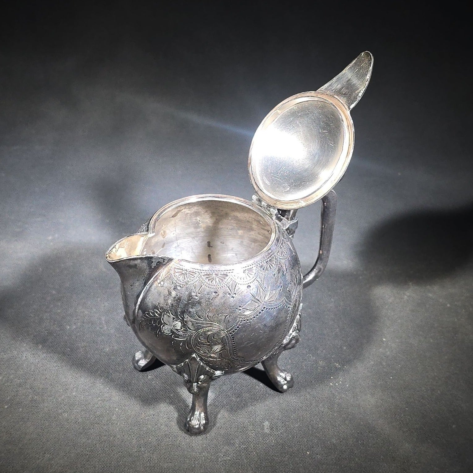 Pair of Antique Silverplate Serving Pieces including Reed & Barton Footed Coffeepot No. 2930 and Monogrammed Spherical Teapot with Lion Mask and Paw Feet