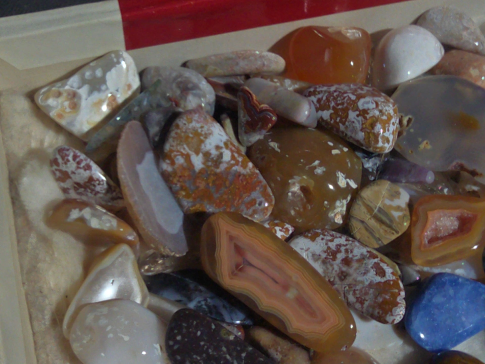 Grouping of Polished Stones and Mineral Specimens Including Agate Slices, Tumbled Agates, and Cabochons