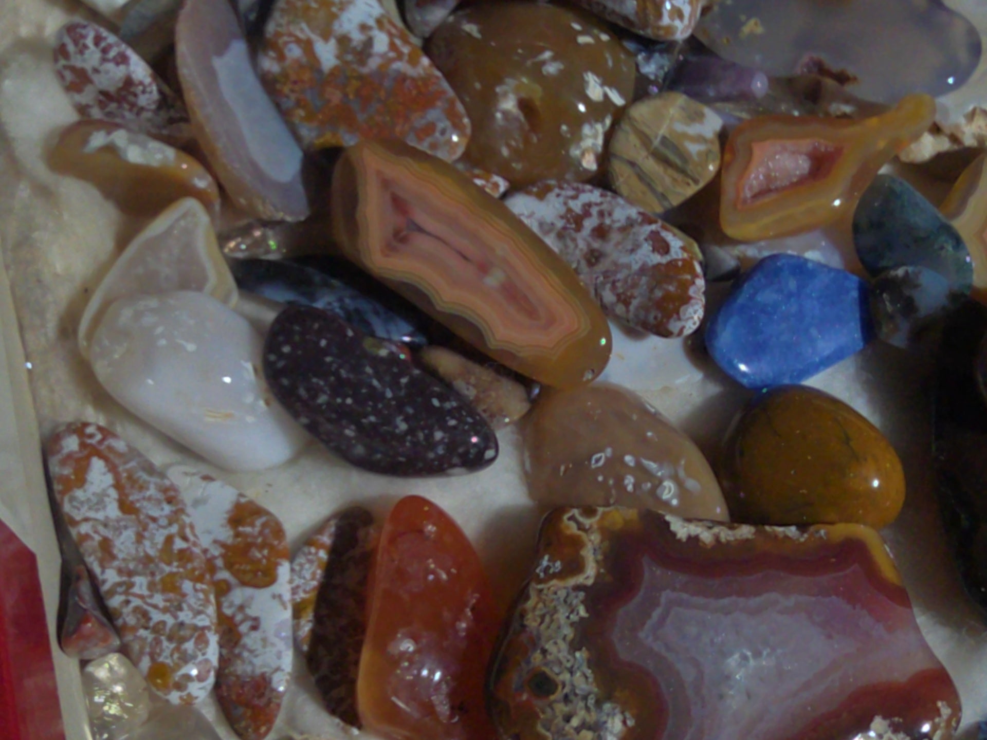 Grouping of Polished Stones and Mineral Specimens Including Agate Slices, Tumbled Agates, and Cabochons
