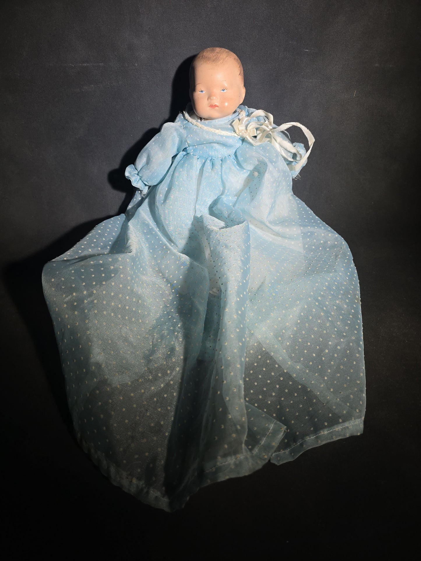 Modern Baby Doll in Blue Polka Dot Christening Gown with Painted Features and White Ribbon Bow