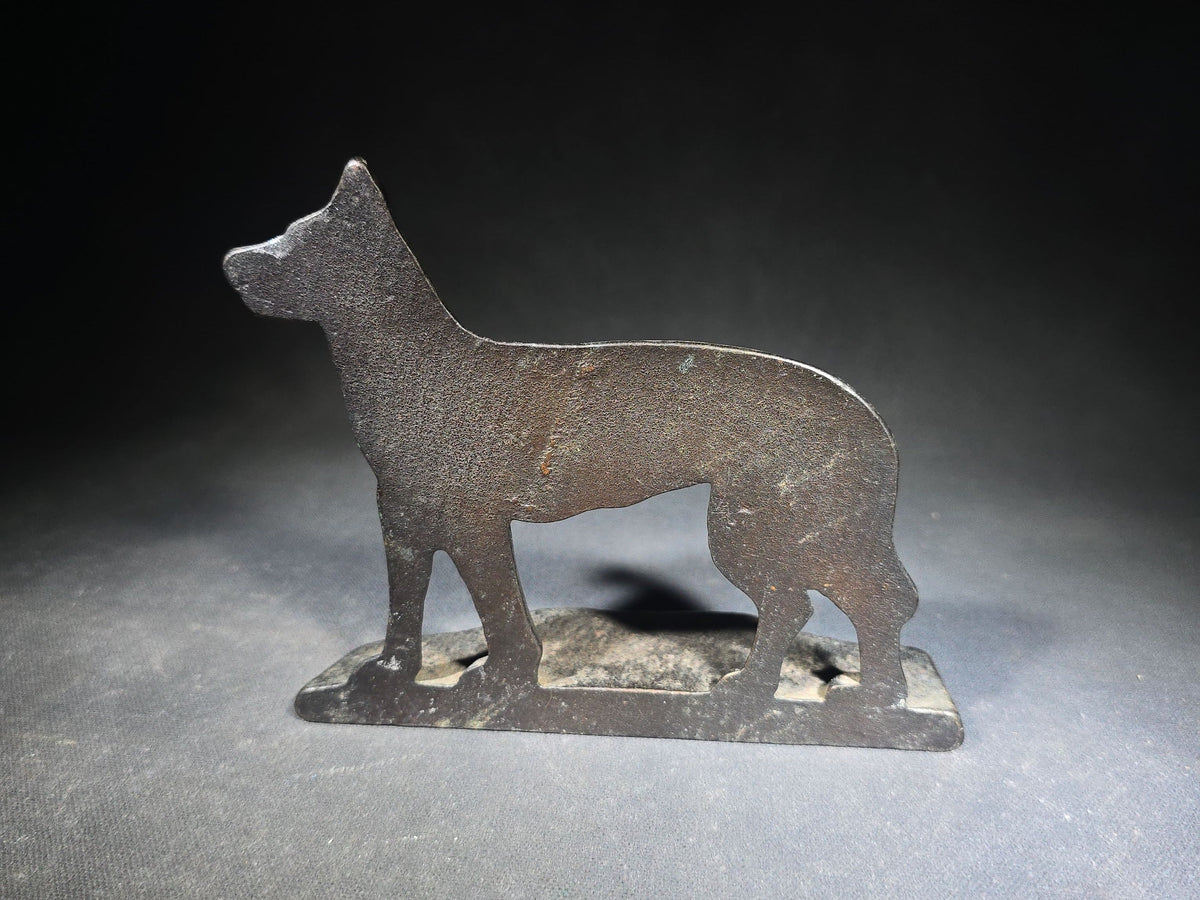 Pair of Antique Mismatched Cast Iron Bookends including a Standing Dog and a Sailing Ship, Manufactured by Bradley & Hubbard Mfg. Co., Meriden, Connecticut