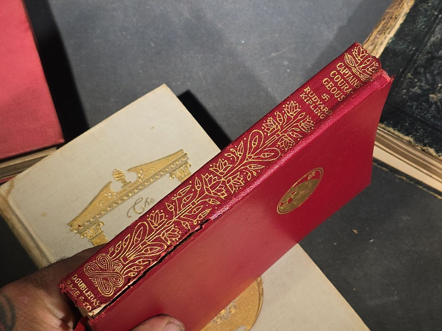 Grouping of Four Antique and Vintage Books including "The Royalty of Friendship" Inscribed to Actor William Gillette at the Garrick Theatre, New York City, 1906, "Captains Courageous" by Rudyard Kipling, and "Spinifex Walkabout"