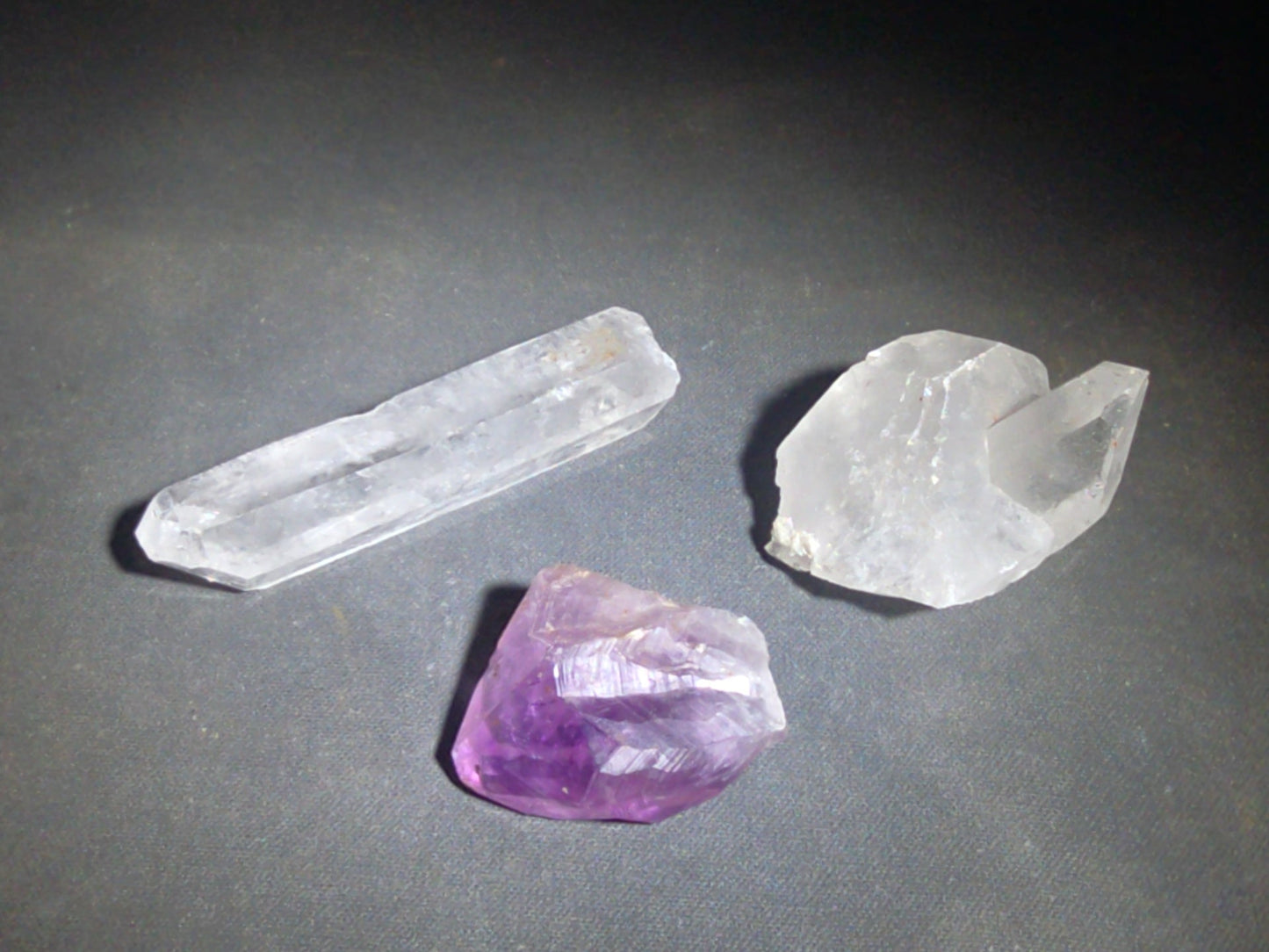 Trio of Quartz Crystal Specimens including Amethyst Point and Two Clear Quartz Points