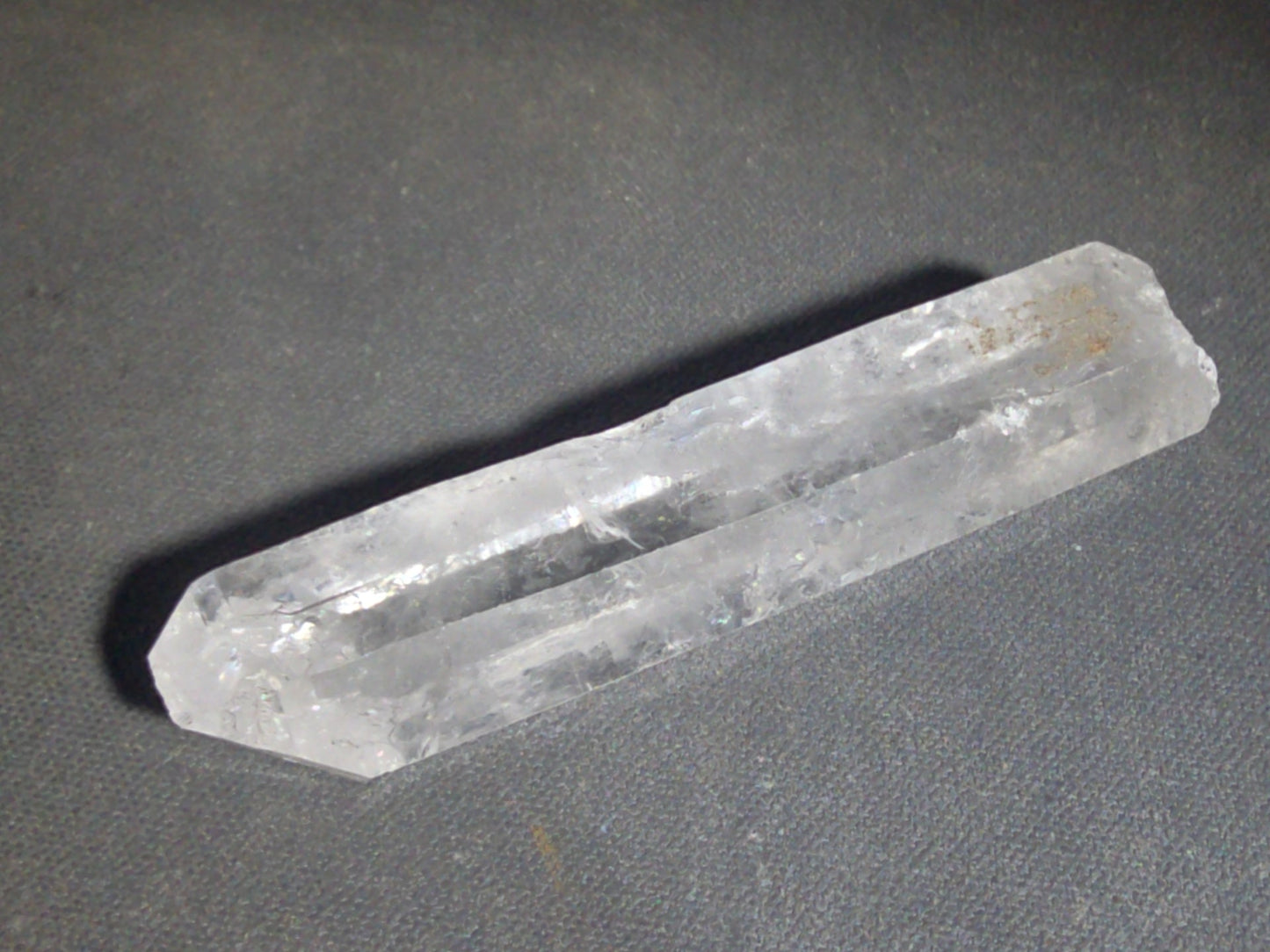Trio of Quartz Crystal Specimens including Amethyst Point and Two Clear Quartz Points