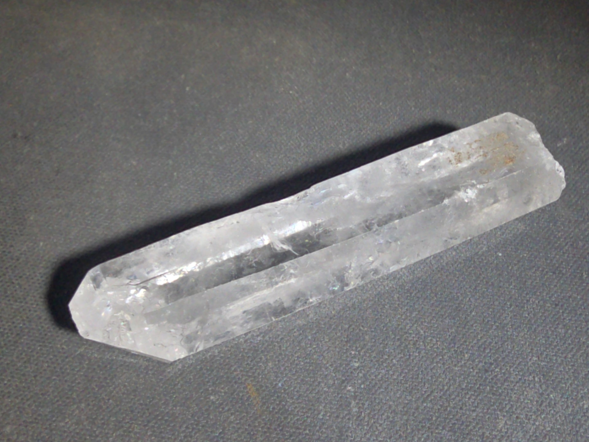 Trio of Quartz Crystal Specimens including Amethyst Point and Two Clear Quartz Points