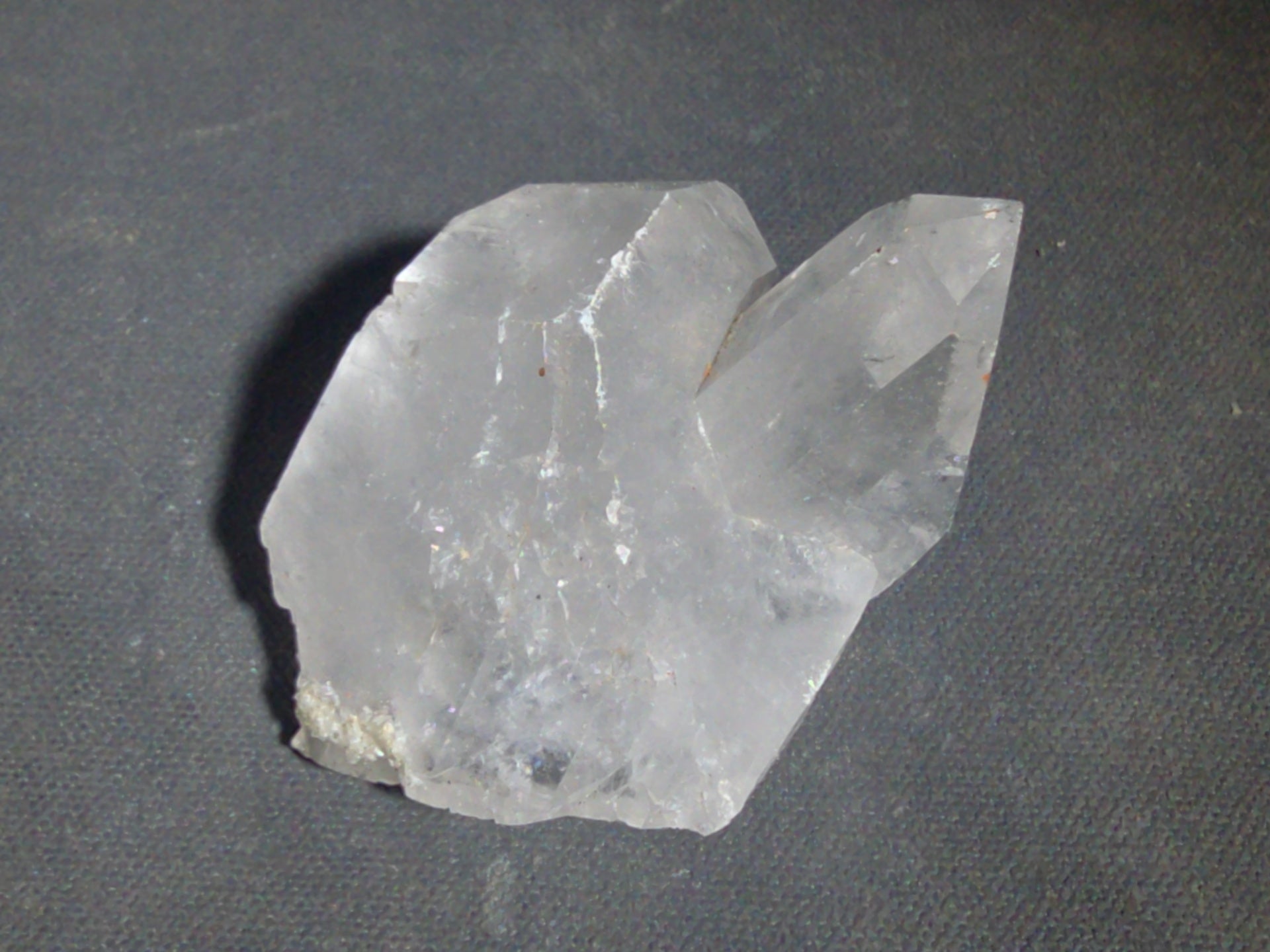 Trio of Quartz Crystal Specimens including Amethyst Point and Two Clear Quartz Points