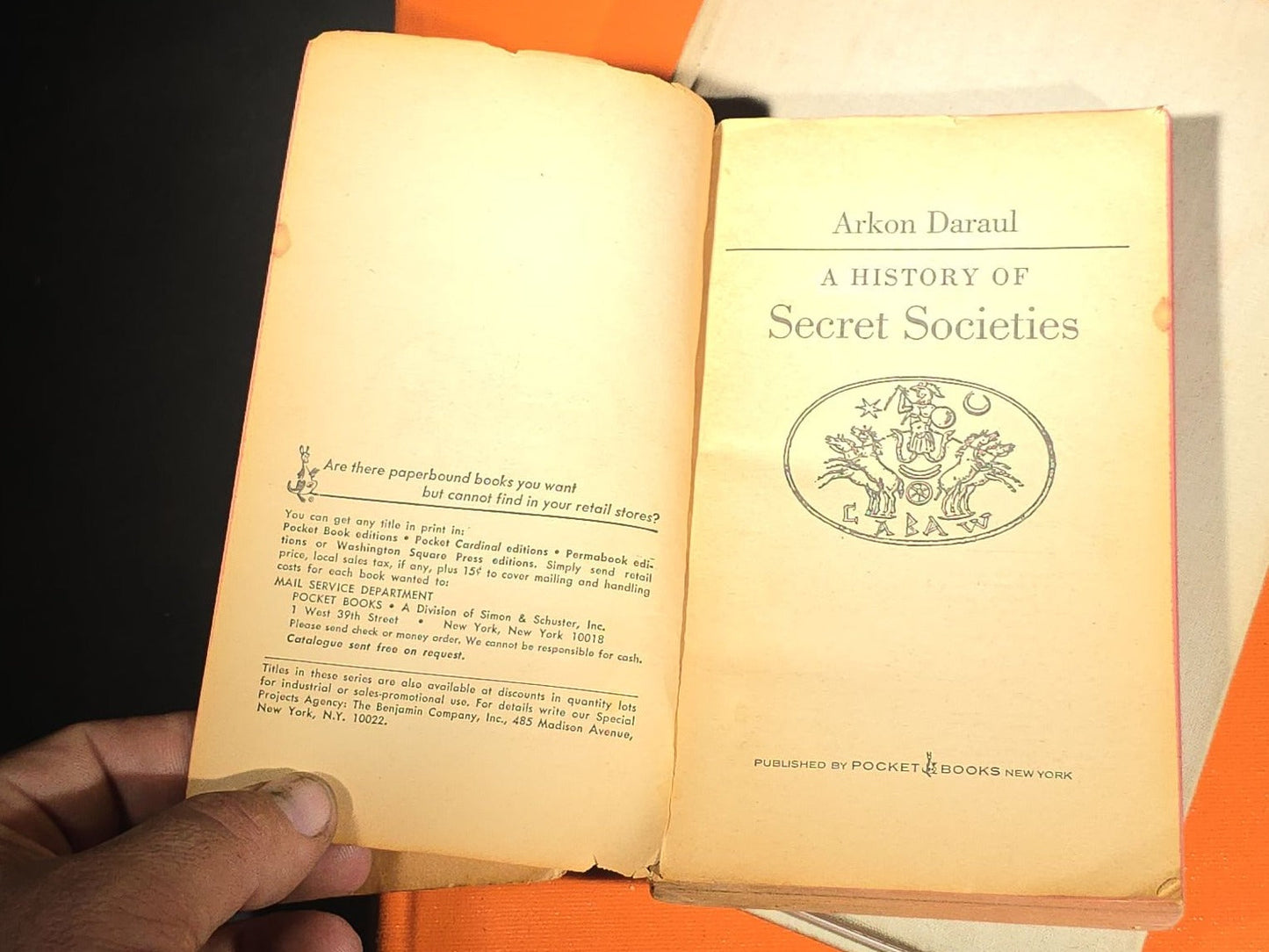Grouping of Four Antique and Vintage Books including "The Microscope and Its Revelations" by William B. Carpenter, "They Called It Purple Heart Valley" by Margaret Bourke-White, "The Encyclopedia of UFOs," and "A History of Secret Societies"