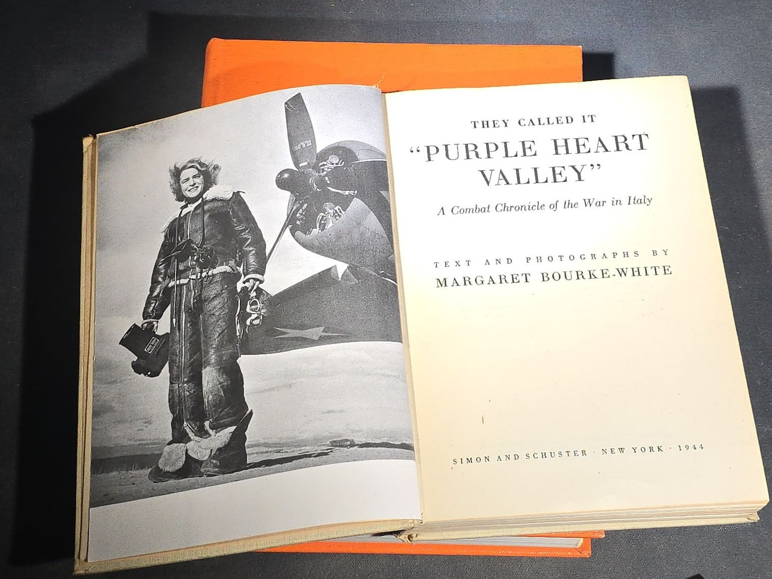 Grouping of Four Antique and Vintage Books including "The Microscope and Its Revelations" by William B. Carpenter, "They Called It Purple Heart Valley" by Margaret Bourke-White, "The Encyclopedia of UFOs," and "A History of Secret Societies"