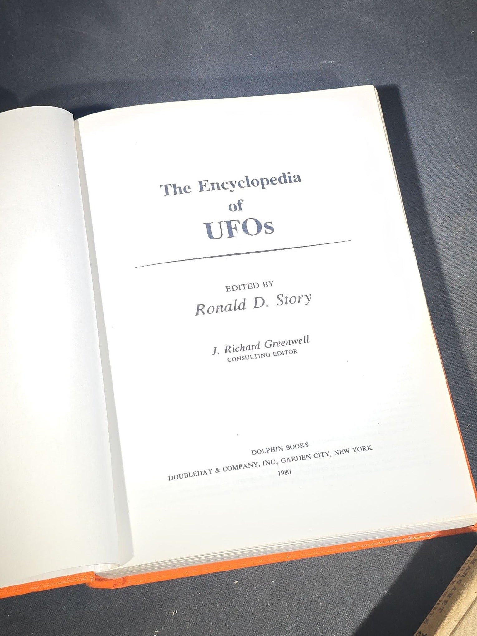 Grouping of Four Antique and Vintage Books including "The Microscope and Its Revelations" by William B. Carpenter, "They Called It Purple Heart Valley" by Margaret Bourke-White, "The Encyclopedia of UFOs," and "A History of Secret Societies"