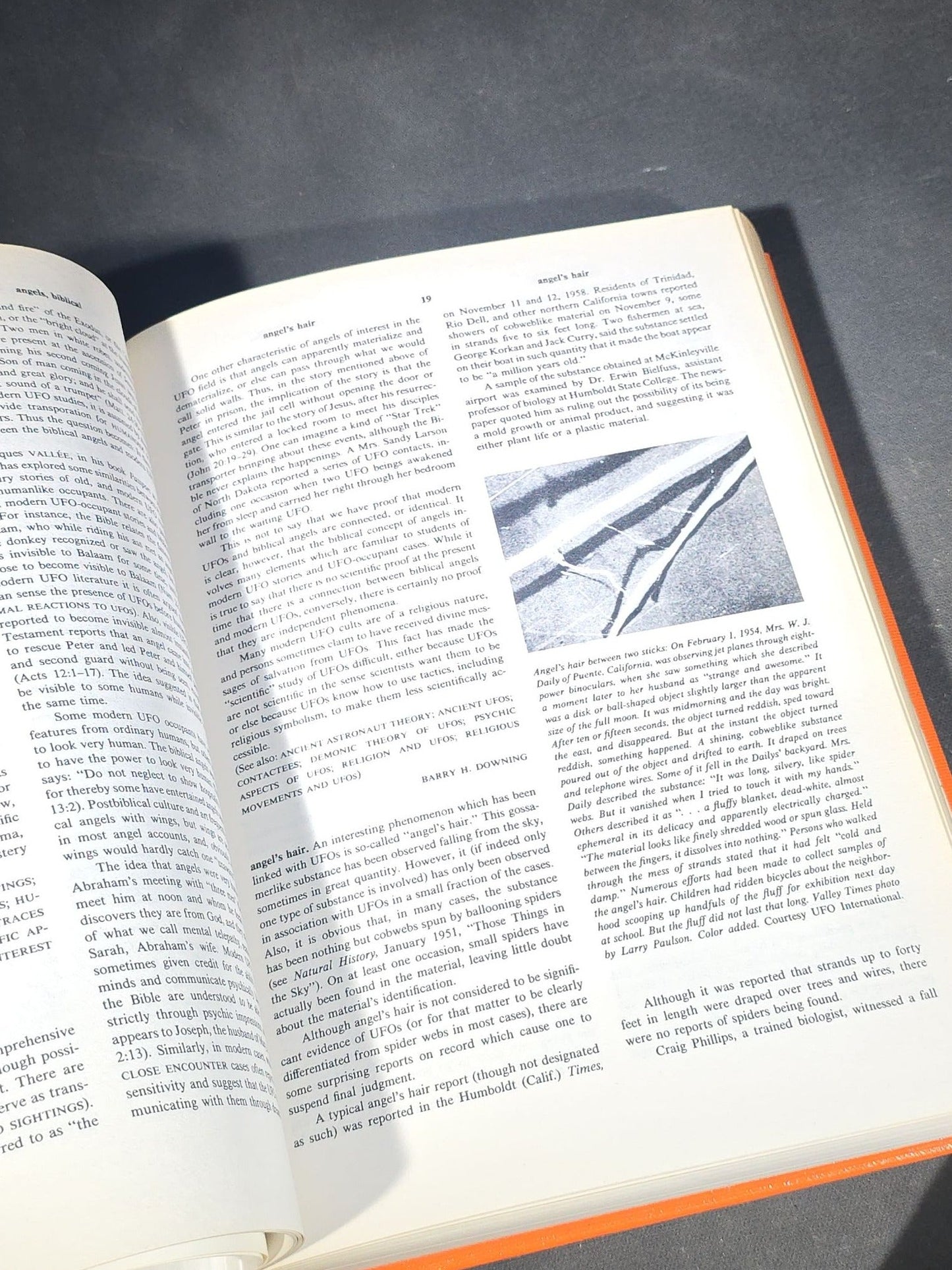 Grouping of Four Antique and Vintage Books including "The Microscope and Its Revelations" by William B. Carpenter, "They Called It Purple Heart Valley" by Margaret Bourke-White, "The Encyclopedia of UFOs," and "A History of Secret Societies"