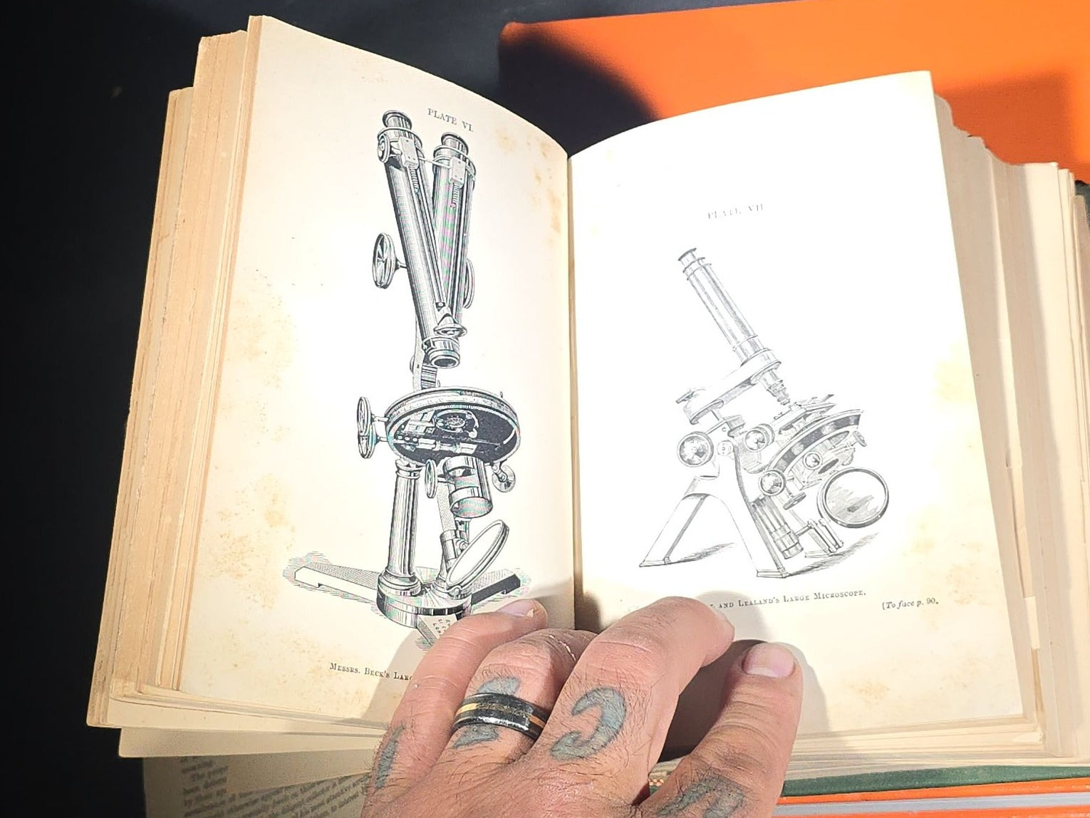 Grouping of Four Antique and Vintage Books including "The Microscope and Its Revelations" by William B. Carpenter, "They Called It Purple Heart Valley" by Margaret Bourke-White, "The Encyclopedia of UFOs," and "A History of Secret Societies"