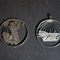 Lot 184 - Pair of Vintage Cut-Out Coin Pendants Including 1941 Walking Liberty Half Dollar and Landscape with Sunburst Rays, Coin Silver