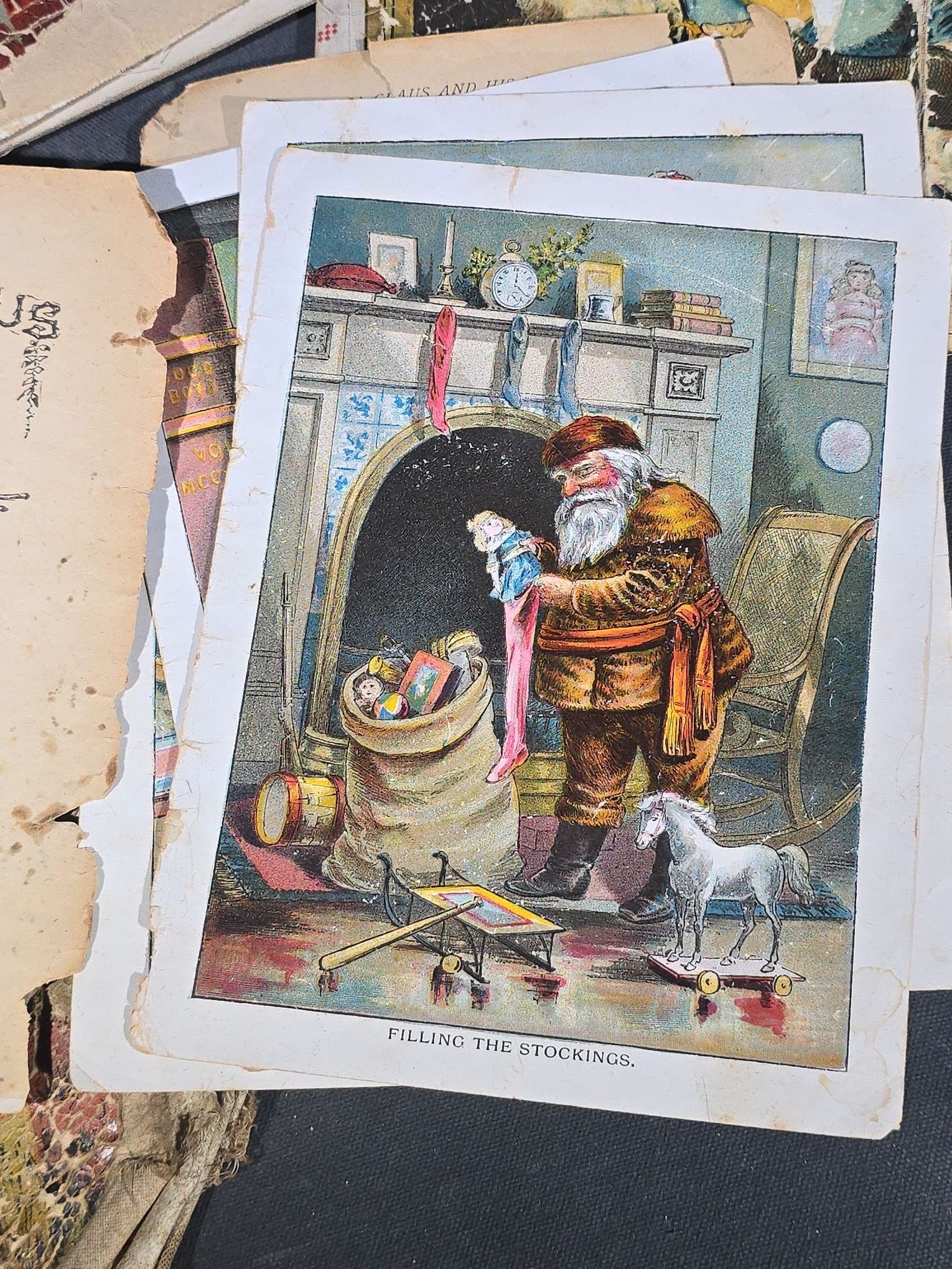 Grouping of Antique Craft Grade Illustrated Children's Books including "The Christmas Basket" by Mrs. Martha J. Lamb (1882), "Santa Claus & His Works" by McLoughlin Bros., "The Night Before Christmas," and Dean's Rag Book "Pets"