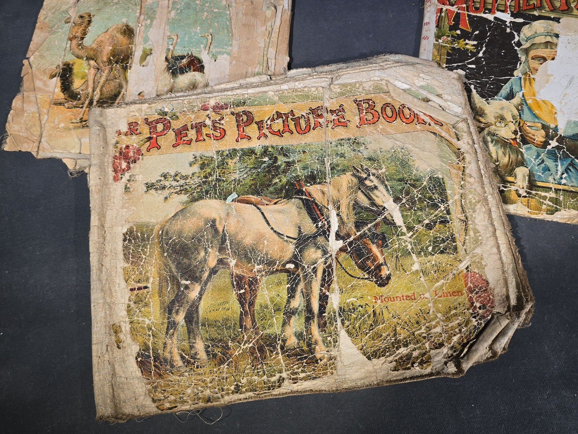 Grouping of Antique Craft Grade Illustrated Children's Books including "The Christmas Basket" by Mrs. Martha J. Lamb (1882), "Santa Claus & His Works" by McLoughlin Bros., "The Night Before Christmas," and Dean's Rag Book "Pets"