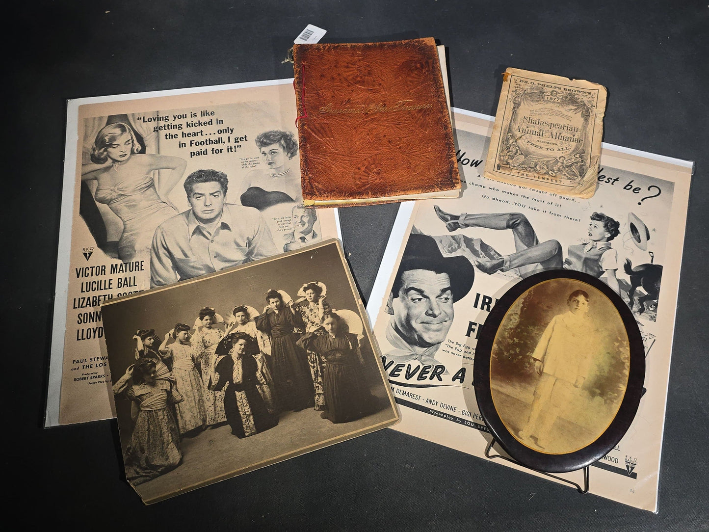 Grouping of Antique and Vintage Ephemera including 1877 "Shakespearian Annual Almanac" by Dr. O. Phelps Brown, "Grandma's Attic Treasures" Embossed Leather Book, Vintage Movie Advertisement Pages, and Celluloid Photo Oval Portrait Button