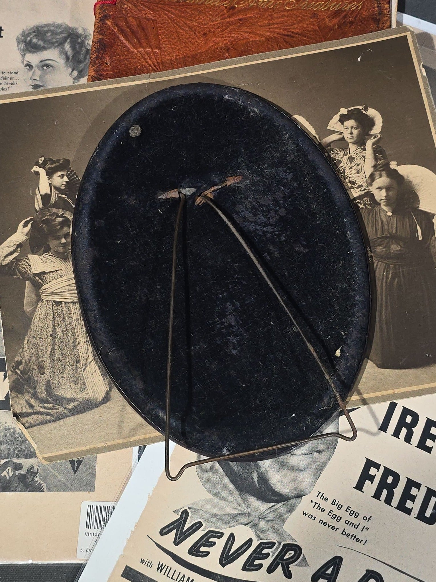 Grouping of Antique and Vintage Ephemera including 1877 "Shakespearian Annual Almanac" by Dr. O. Phelps Brown, "Grandma's Attic Treasures" Embossed Leather Book, Vintage Movie Advertisement Pages, and Celluloid Photo Oval Portrait Button