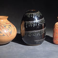 Lot 187 - Trio of Vintage Pottery Vessels Including Mata Ortiz Olla Signed Miguel Lopez, Black Ovoid Vase with White Drip Bands, and Mesoamerican-Style Reproduction Vessel