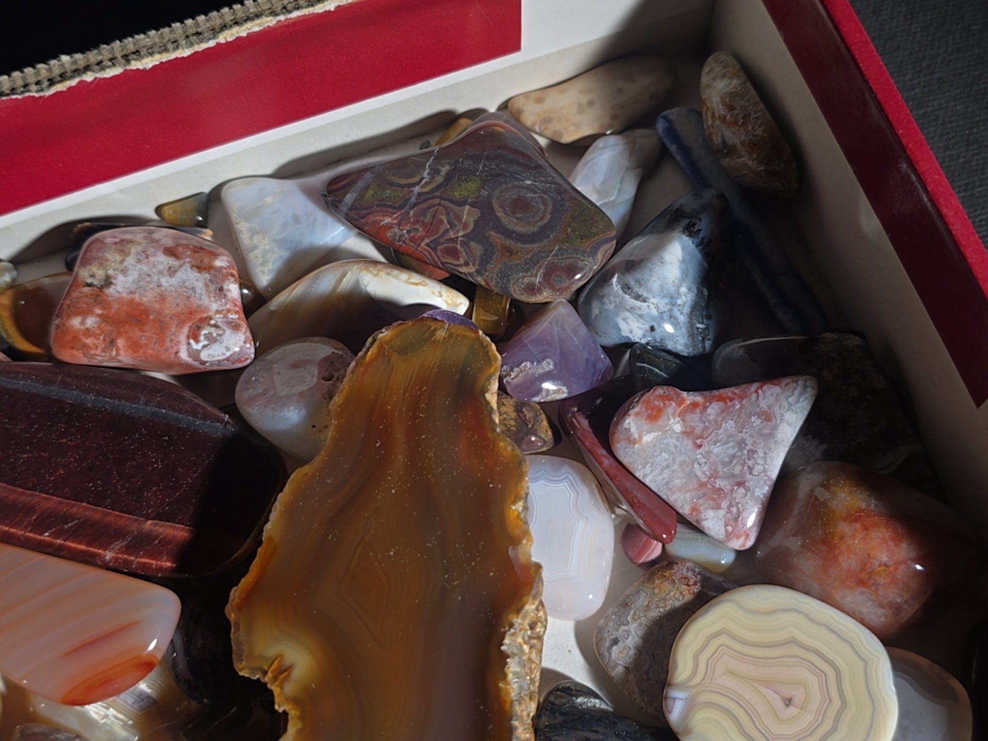 Grouping of Polished Stones and Mineral Specimens including Agate Slices, Tiger's Eye, Jasper, and Amethyst