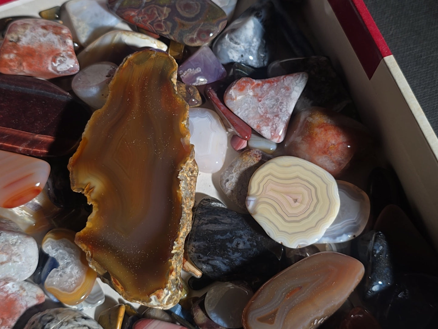 Grouping of Polished Stones and Mineral Specimens including Agate Slices, Tiger's Eye, Jasper, and Amethyst