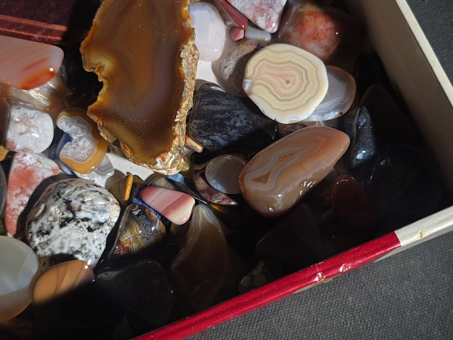 Grouping of Polished Stones and Mineral Specimens including Agate Slices, Tiger's Eye, Jasper, and Amethyst
