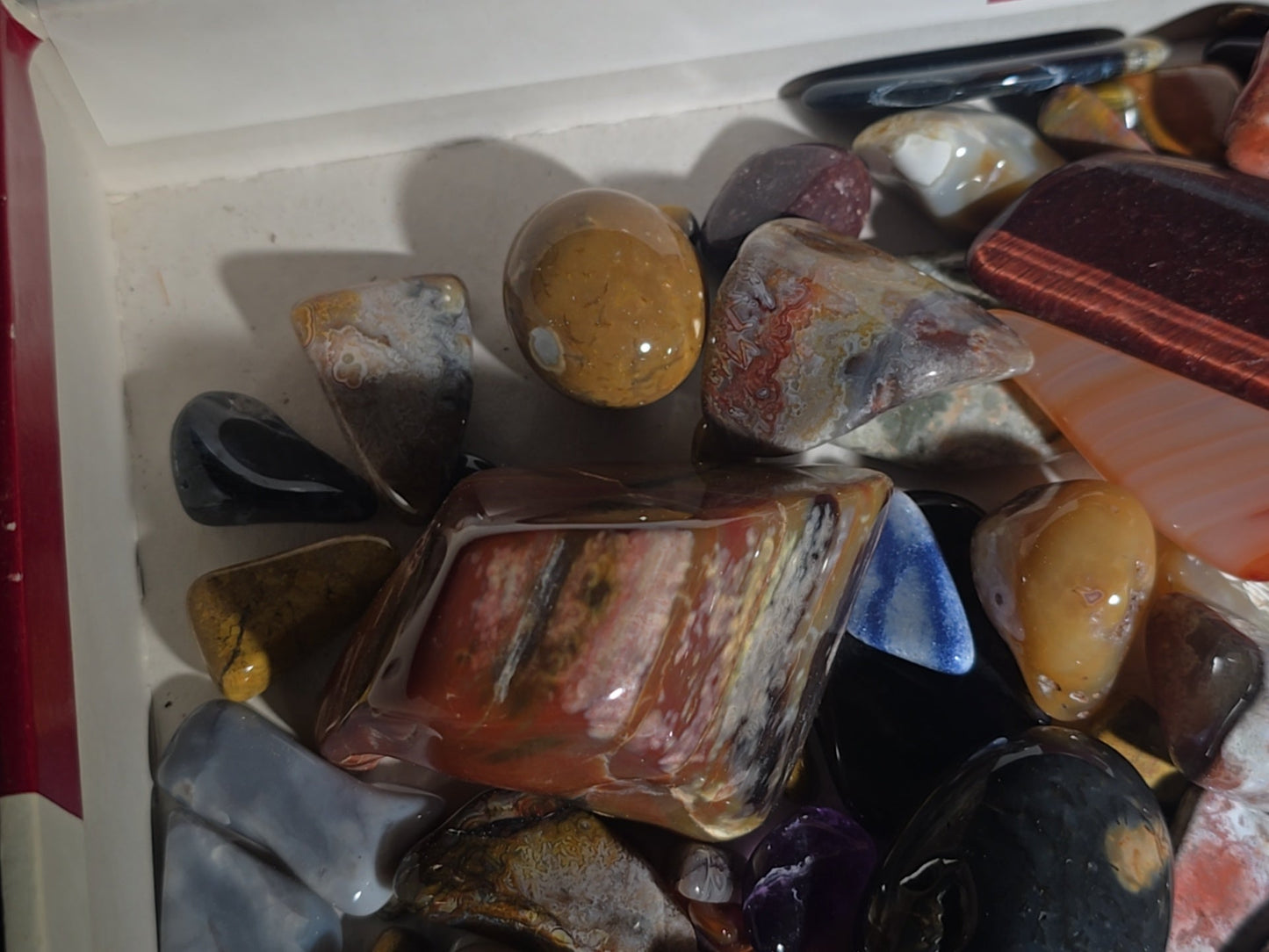 Grouping of Polished Stones and Mineral Specimens including Agate Slices, Tiger's Eye, Jasper, and Amethyst