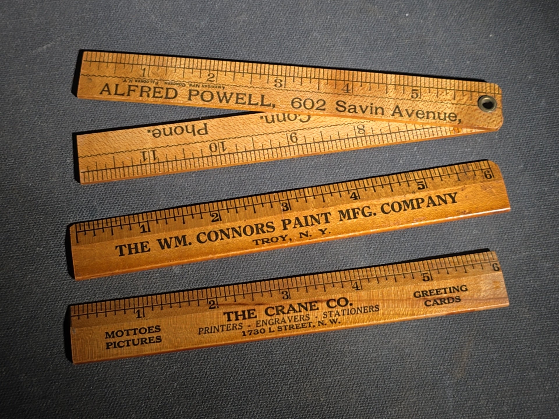 Grouping of 14 Antique and Vintage Smalls including 10 Wooden Advertising Rulers and Four Small Glass Bottles