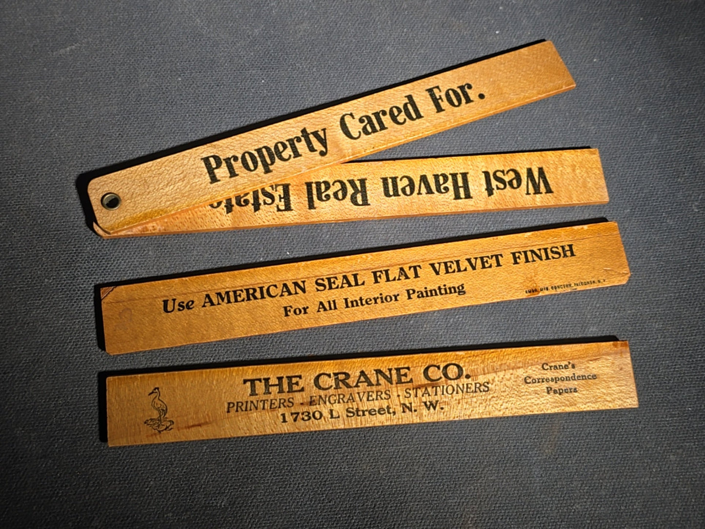 Grouping of 14 Antique and Vintage Smalls including 10 Wooden Advertising Rulers and Four Small Glass Bottles