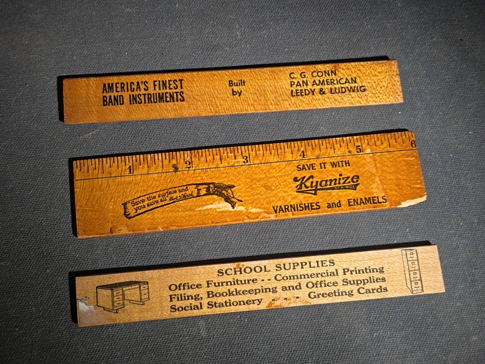 Grouping of 14 Antique and Vintage Smalls including 10 Wooden Advertising Rulers and Four Small Glass Bottles