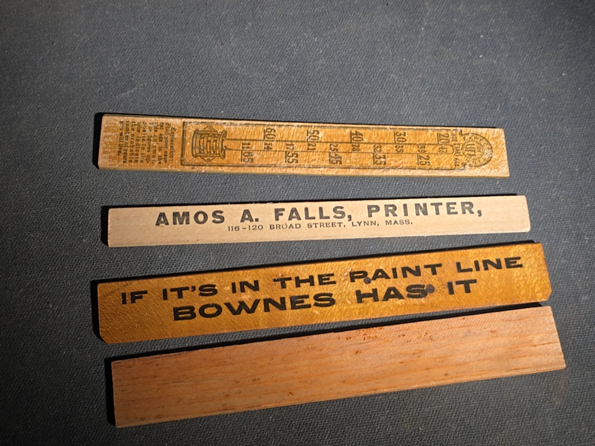 Grouping of 14 Antique and Vintage Smalls including 10 Wooden Advertising Rulers and Four Small Glass Bottles
