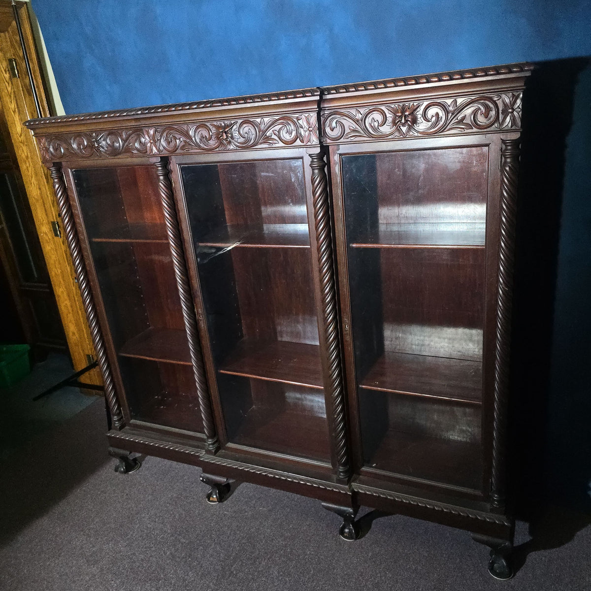 Antique Carved Three-Door Glass-Front Bookcase with Green Man Masks, Rope-Twist Columns, and Claw-and-Ball Feet