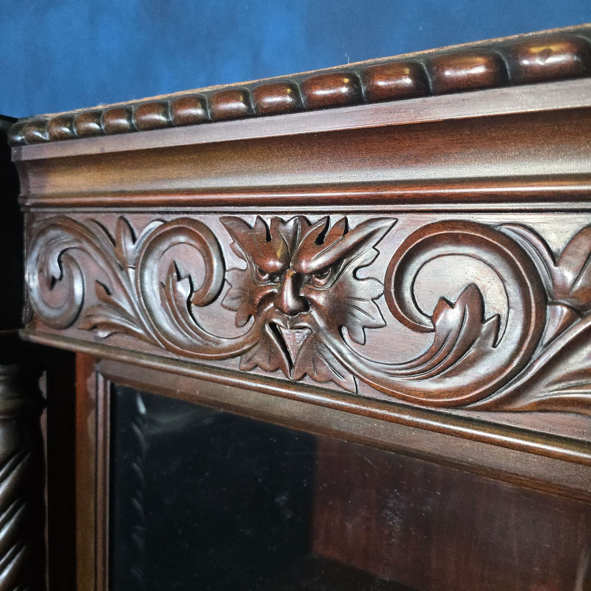 Antique Carved Three-Door Glass-Front Bookcase with Green Man Masks, Rope-Twist Columns, and Claw-and-Ball Feet