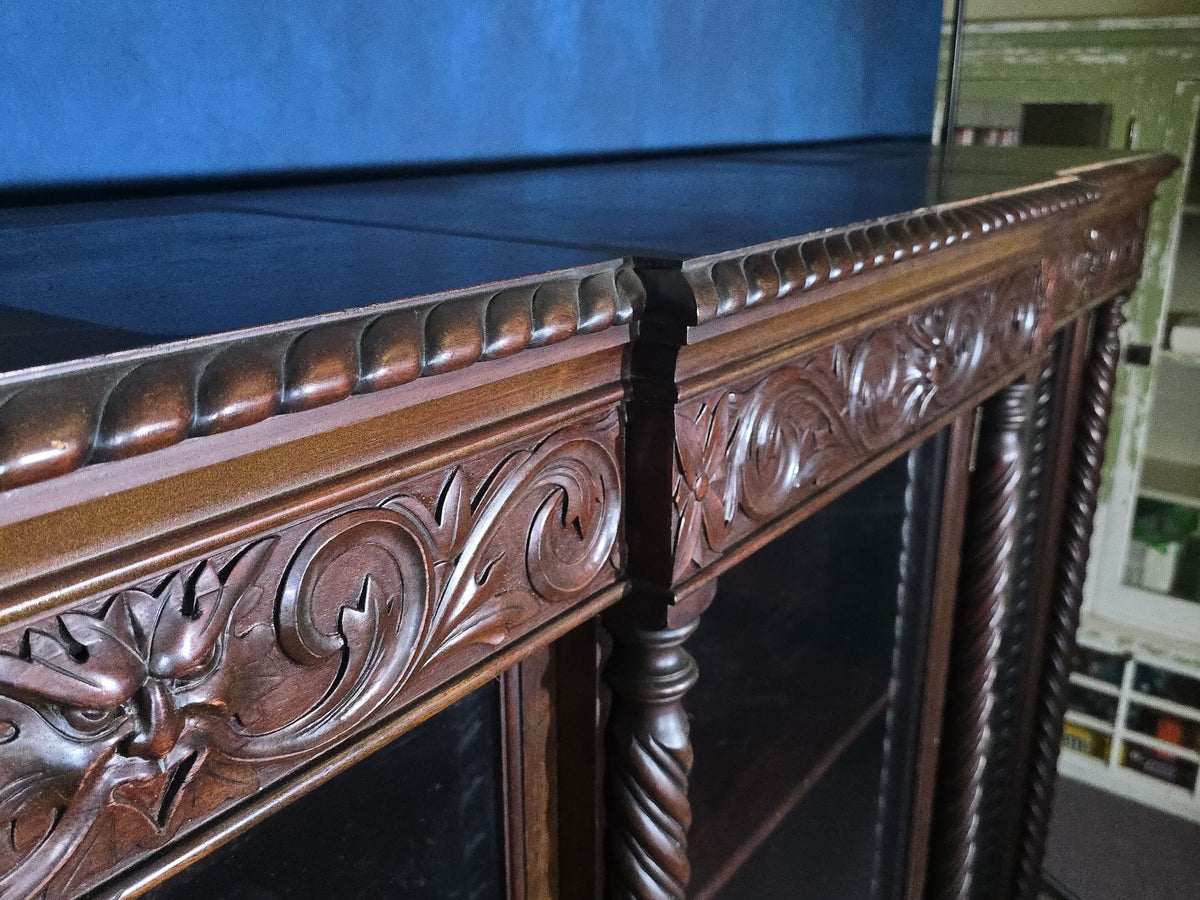 Antique Carved Three-Door Glass-Front Bookcase with Green Man Masks, Rope-Twist Columns, and Claw-and-Ball Feet