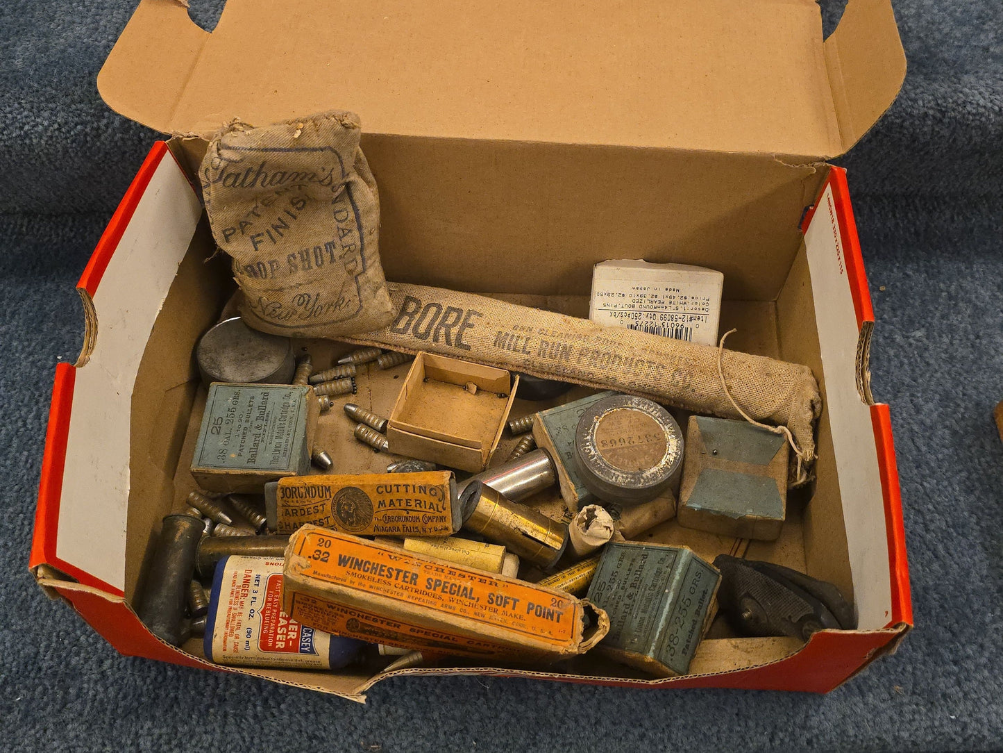 Grouping of Antique and Vintage Ammunition Boxes with Contents and Gun Accessories including Winchester .40-72 Cartridges for Model 1895, Union Metallic Cartridge Co. Ballard & Bullard Bullets, and Colt Grip Panel