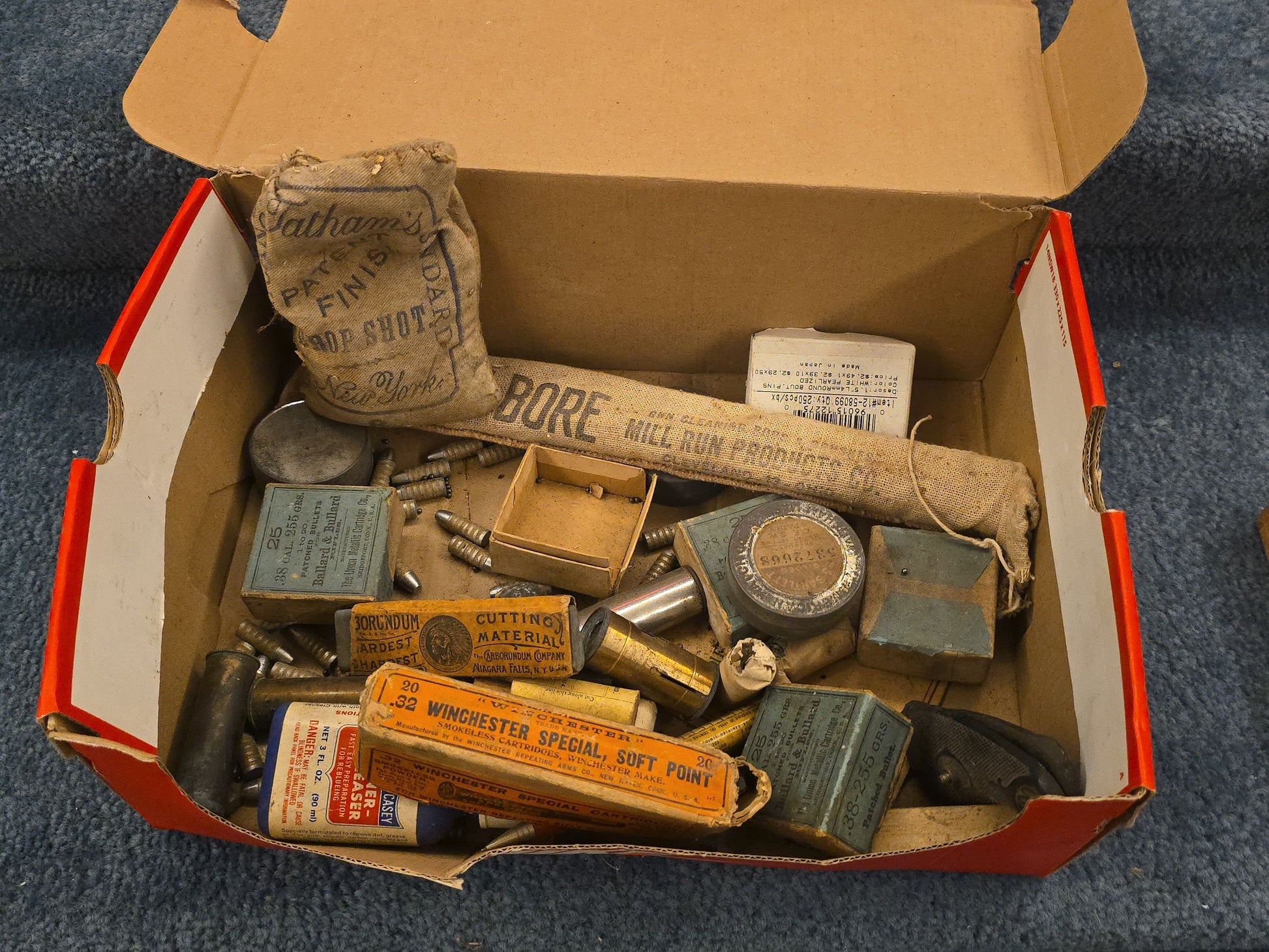 Grouping of Antique and Vintage Ammunition Boxes with Contents and Gun Accessories including Winchester .40-72 Cartridges for Model 1895, Union Metallic Cartridge Co. Ballard & Bullard Bullets, and Colt Grip Panel