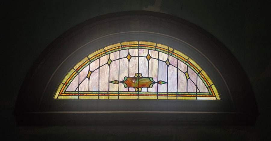Half-moon window in the old upper-level Sunday-school room