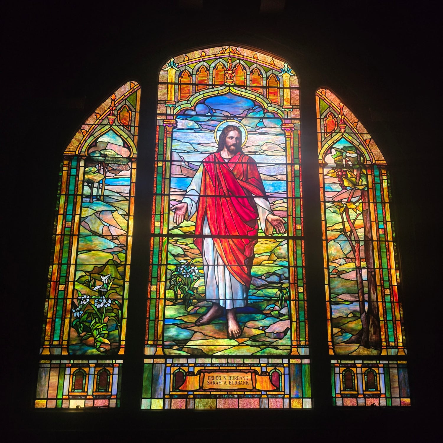 Large stained-glass window depicting Christ, in memory of Peleg N. and Sarah A. Burbank