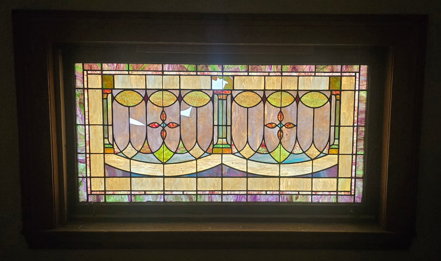 Damaged window over the main entrance on the upper level
