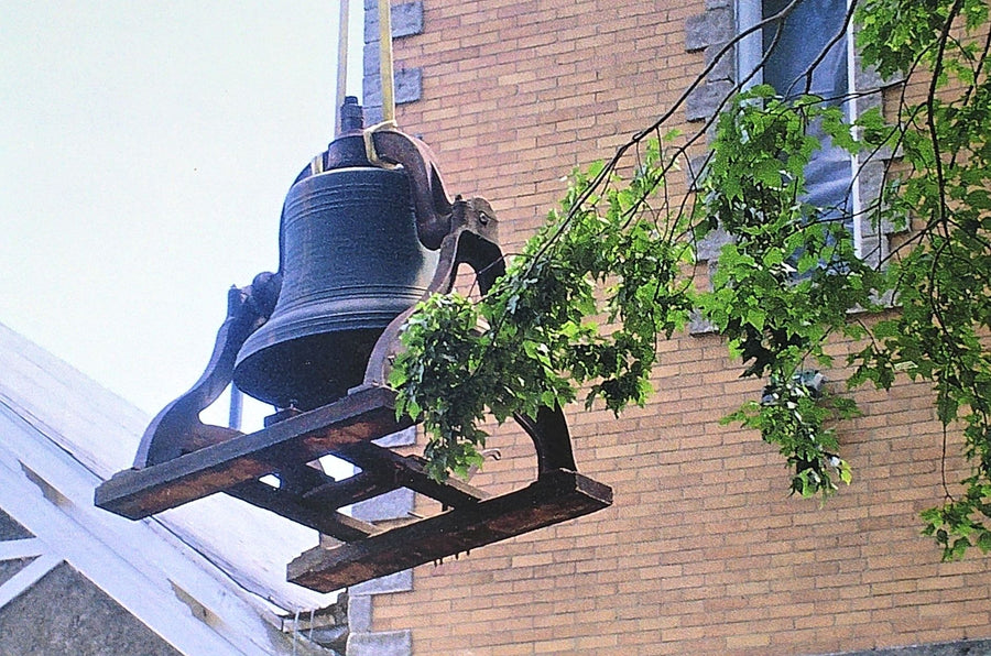 The bell hoisted clear of the tower