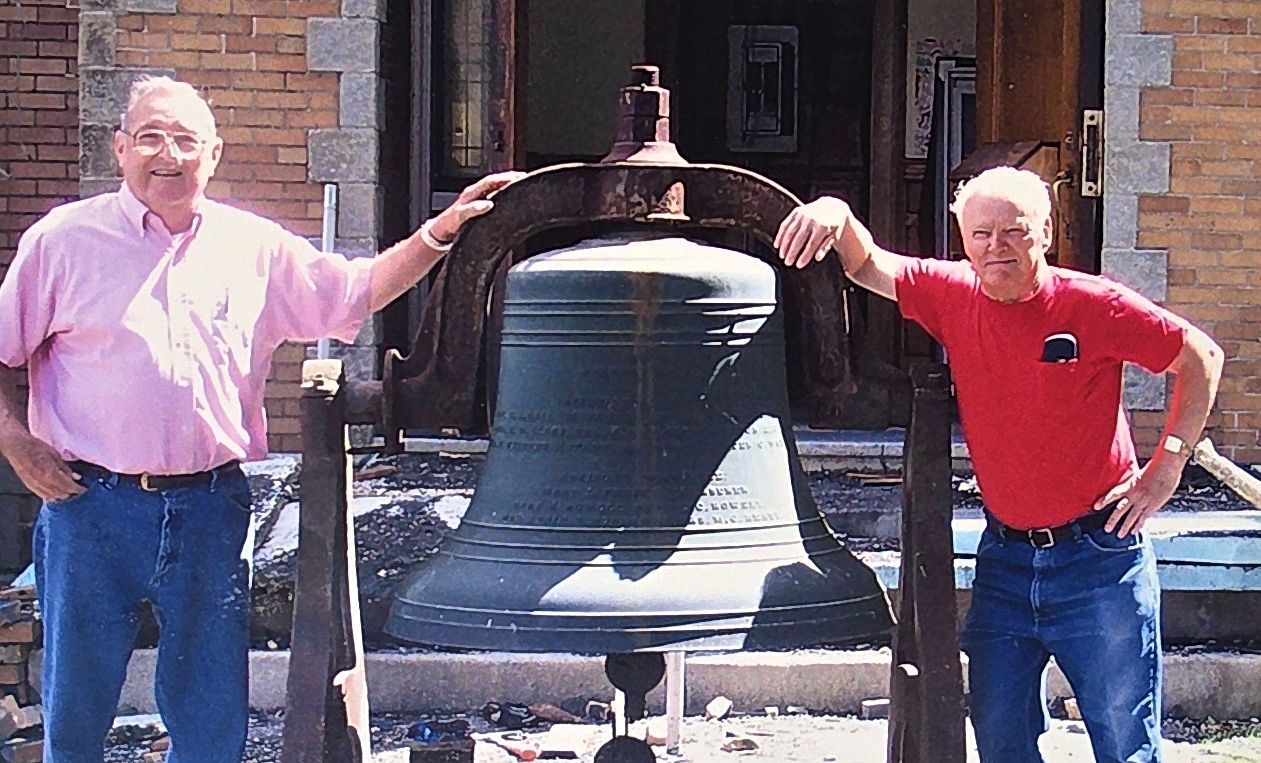 Mason brethren with the bell at ground level after its removal from the tower