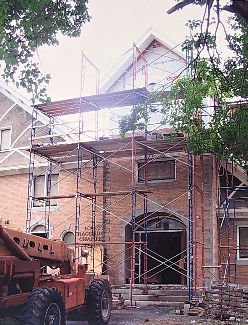 Scaffolding up the tower as new brick goes in