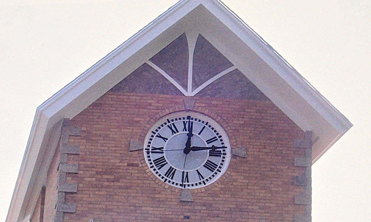 The finished one-story tower with a single clock face